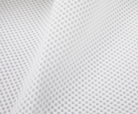 Close-up of the white polyester mesh from the Cradlewise Standard Mesh Bundle, showing its fine hexagonal weave and evenly spaced openings that allow airflow through the bassinet and crib sides.