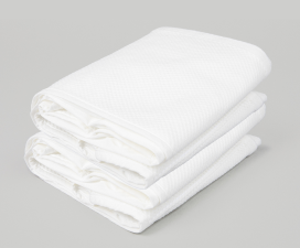 Folded white Cradlewise Standard Mesh Bundle displayed against a light gray background, showing the lightweight mesh panels neatly stacked with their folded edges visible.