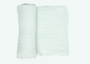 Mint Cradlewise Muslin Blanket partially rolled to show its lightweight construction and naturally crinkled muslin weave.